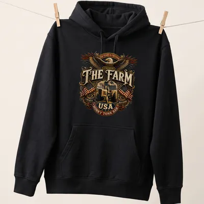 Vintage emblem of an eagle and tractor with patriotic text in brown, gold, red, blue, and white — printed on a unisex hoodie
