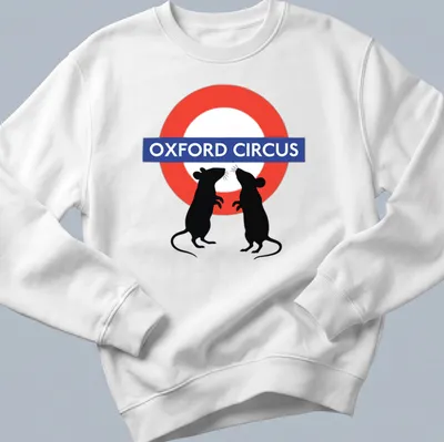 Whimsical graphic of fighting mice with Oxford Circus text above in red, blue, black, and white. — printed on a unisex sweatshirt