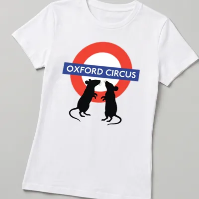 Whimsical graphic of fighting mice with Oxford Circus text above in red, blue, black, and white. — printed on a women's shirt