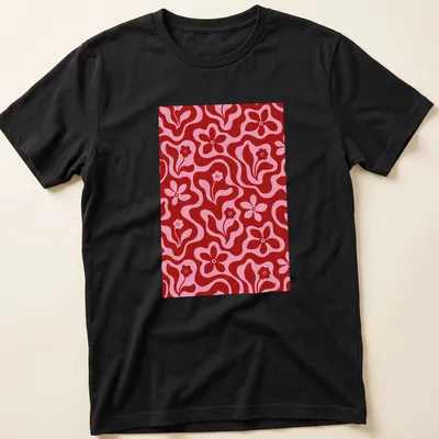 Retro floral pattern in red and pink on a T-shirt featuring flowers