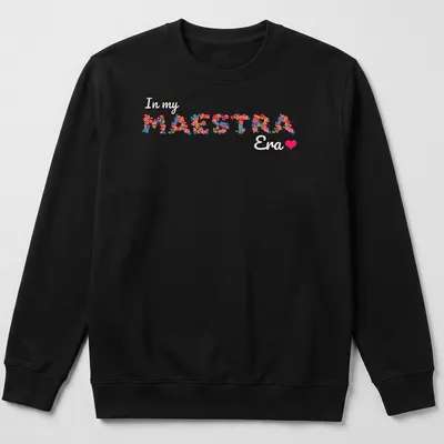 Colorful floral design with the text 'In my MAESTRA Era' — printed on a unisex sweatshirt