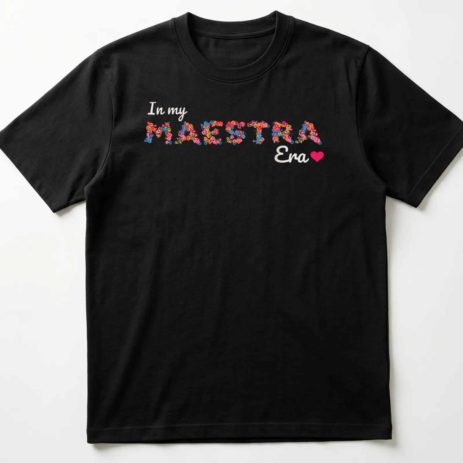 Colorful floral design with the text 'In my MAESTRA Era' — printed on a unisex t-shirt
