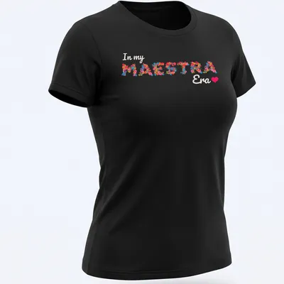 Colorful floral design with the text 'In my MAESTRA Era' — printed on a women's shirt