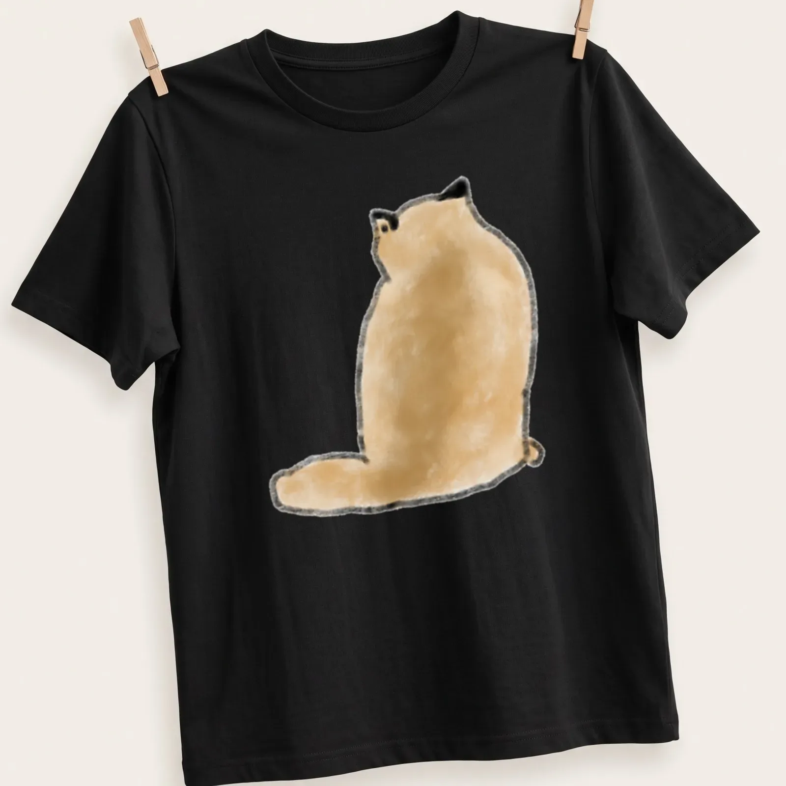 Minimalist illustration of a fluffy tan cat sitting from the back, tail arched — printed on a unisex t-shirt