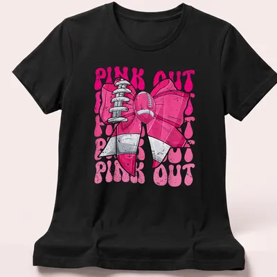 Bold graphic of a football bow with 'PINK OUT' text for breast cancer awareness — printed on a women's shirt