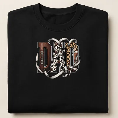 Leopard print typography spelling out DAD with a football theme — printed on a unisex sweatshirt