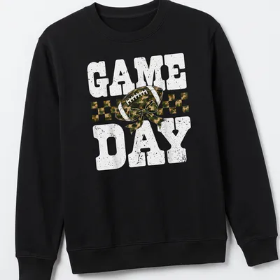 Camo print shirt with playful football and bow graphic, text reads 'GAME DAY' — printed on a unisex sweatshirt