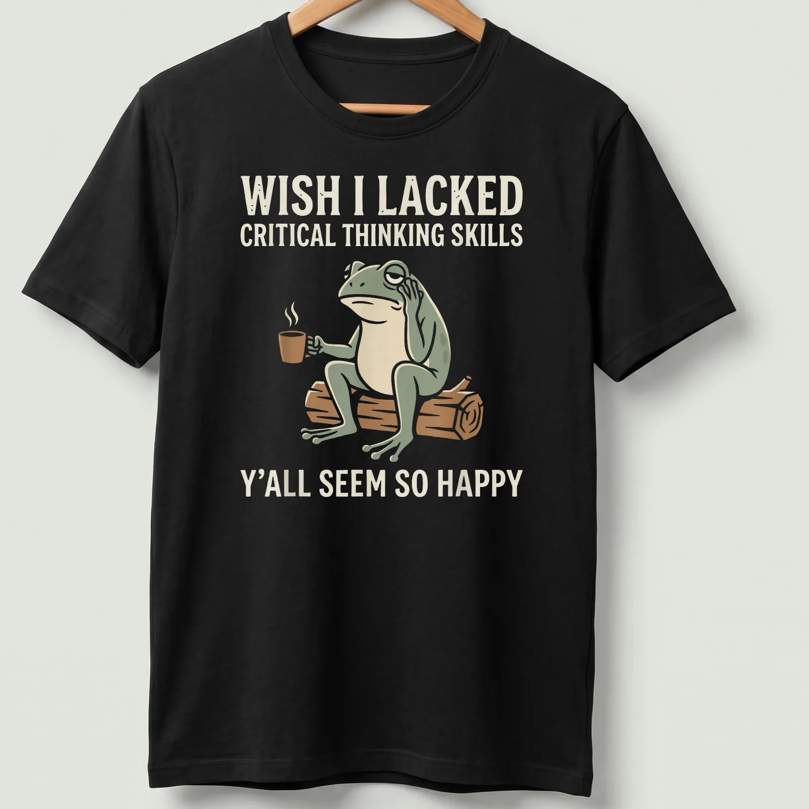 Cartoon frog holding coffee with text about critical thinking skills and happiness — printed on a unisex t-shirt