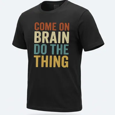 Retro t-shirt with a funny ADHD quote and a graphic of a brain in vibrant colors