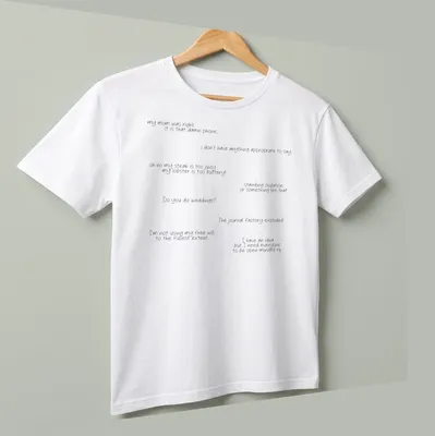 T-shirt displaying humorous quotes in a playful handwritten style in black and white — printed on a unisex t-shirt (angled view)