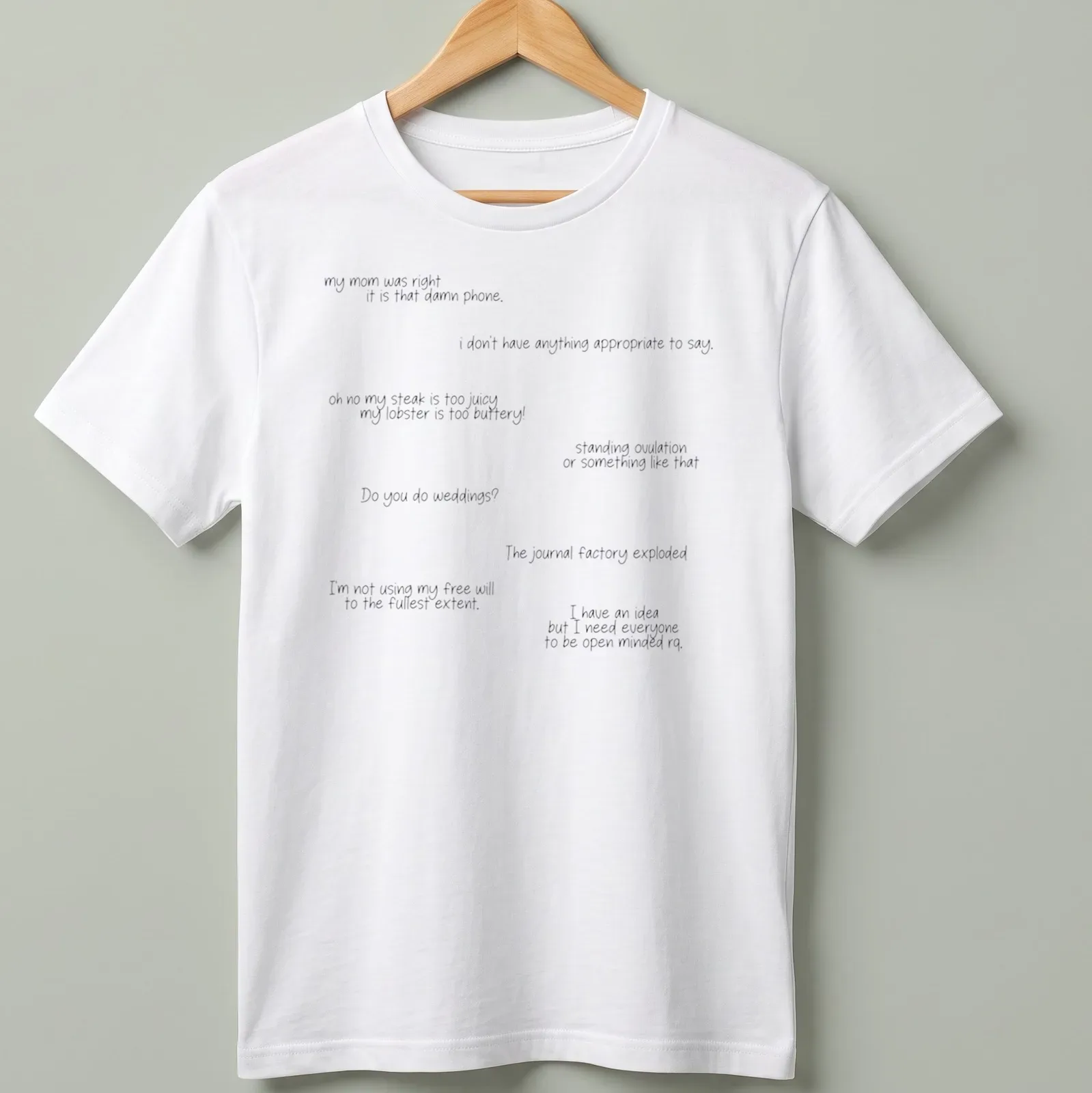 T-shirt displaying humorous quotes in a playful handwritten style in black and white — printed on a unisex t-shirt