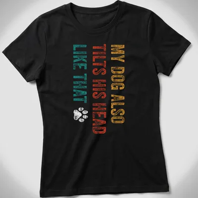 Distressed print of a dog with humorous text about head tilting in teal and orange — printed on a women's shirt