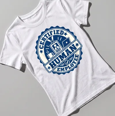 Navy and cream t-shirt featuring a badge design that says 'Certified Human Employee.' — printed on a women's shirt