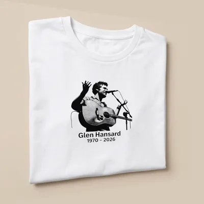 Halftone illustration of Glen Hansard with acoustic guitar, black and white design — printed on a unisex t-shirt (angled view)