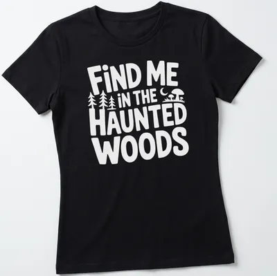 Mystical illustration of haunted woods with text 'Find Me In The Haunted Woods' in dark green, black, purple, and orange. — printed on a women's shirt
