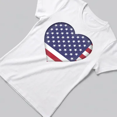 3D heart graphic featuring the American flag in red, white, and blue — printed on a women's shirt