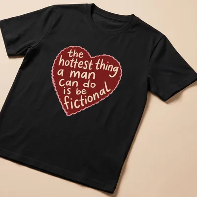 Cartoonish heart graphic with playful text about romance printed on a t-shirt