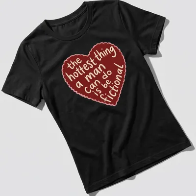 Cartoonish heart graphic with playful text about romance printed on a — printed on a women's shirt