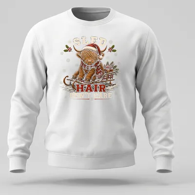 Vintage print of a Highland cow with the text Sled Hair Don't Care for Christmas — printed on a unisex sweatshirt