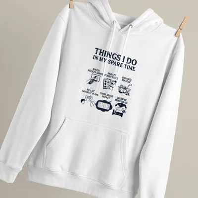 Typography design listing hockey-related activities in bold text on navy background — printed on a unisex hoodie