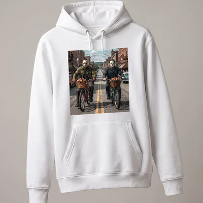 Realistic graphic of Jason Voorhees and Michael Myers riding bicycles in vibrant colors — printed on a unisex hoodie