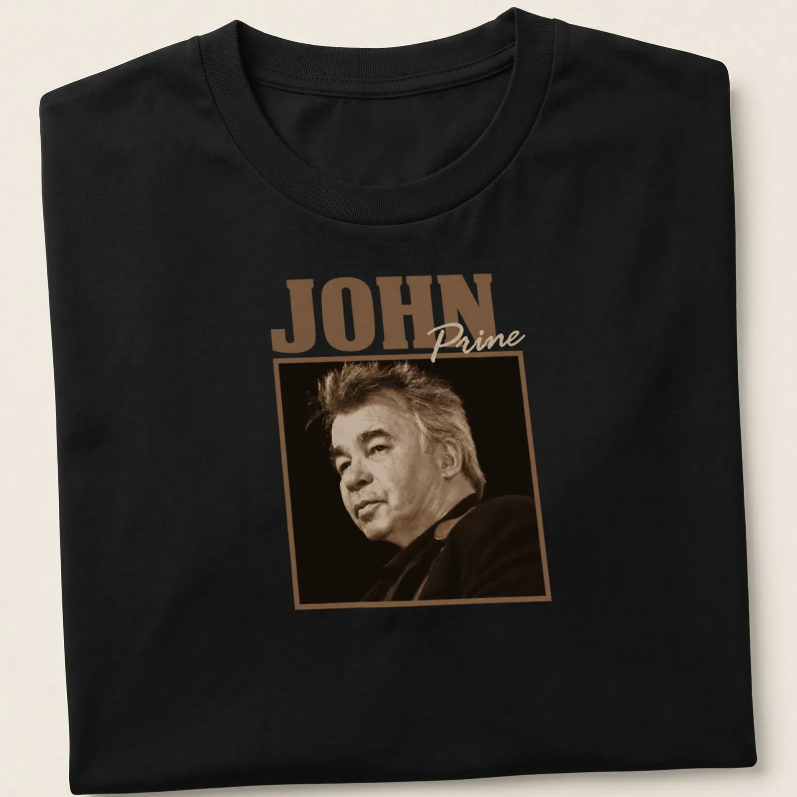Vintage sepia John Prine t-shirt with classic text design in brown and cream — printed on a unisex t-shirt