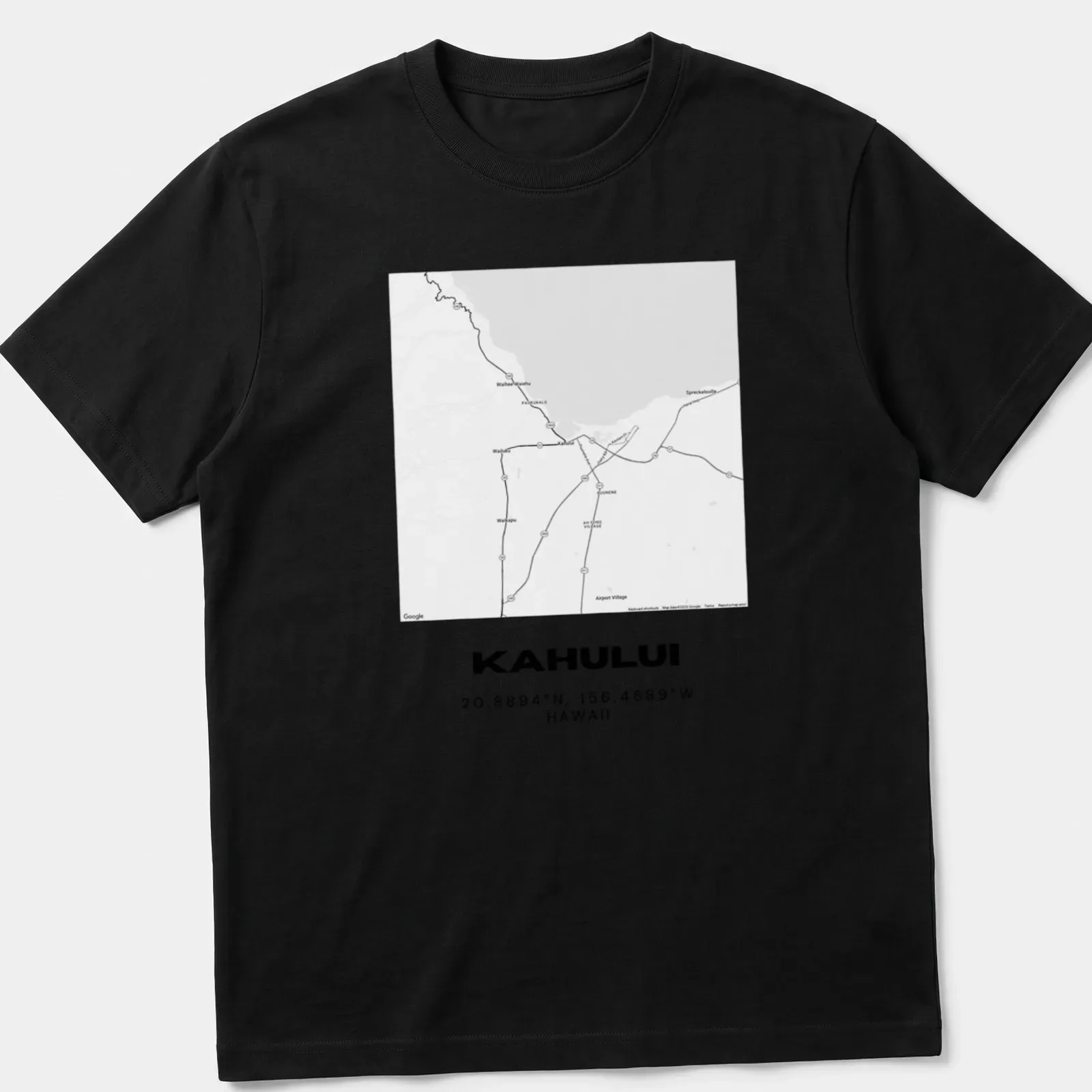 Minimalist t-shirt with black text displaying Kahului map coordinates — printed on a unisex t-shirt