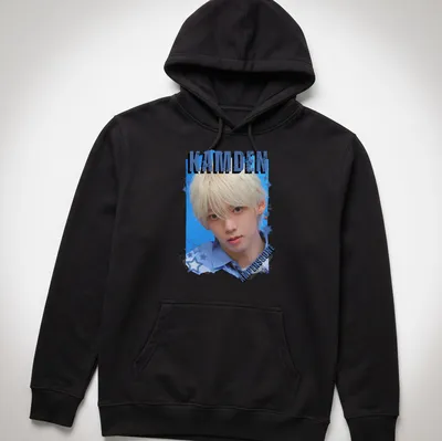 Digital art collage featuring KPOP boy group member with text KAMDEN AMPERS&ONE — printed on a unisex hoodie