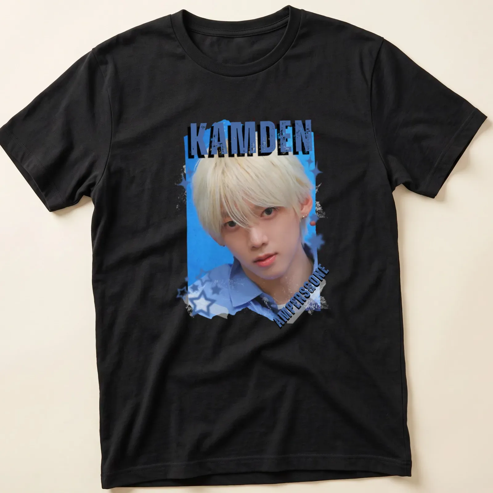 Digital art collage featuring KPOP boy group member with text KAMDEN AMPERS&ONE — printed on a unisex t-shirt