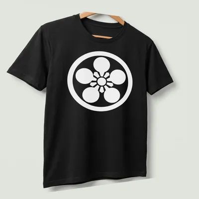 Traditional Japanese Kamon design in bold red, black, and white on a — printed on a unisex t-shirt (angled view)