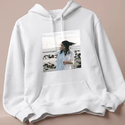 Photographic print of a woman by the beach with text 'blue water road' in blue and white — printed on a unisex hoodie