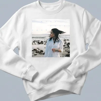 Photographic print of a woman by the beach with text 'blue water road' in blue and white — printed on a unisex sweatshirt