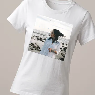 Photographic print of a woman by the beach with text 'blue water road' in blue and white — printed on a women's shirt