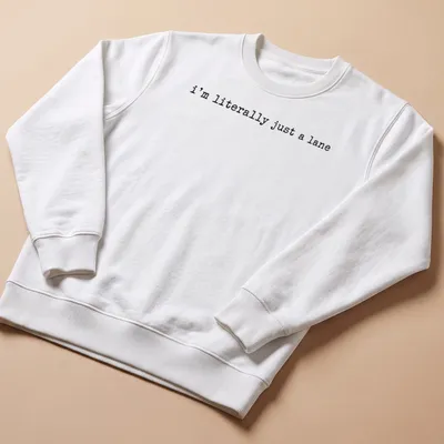 Simple text design with black lettering that reads 'I'm literally just a lane' on a white — printed on a unisex sweatshirt