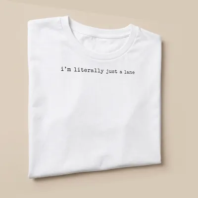 Simple text design with black lettering that reads 'I'm literally just a lane' on a white — printed on a unisex t-shirt (angled view)