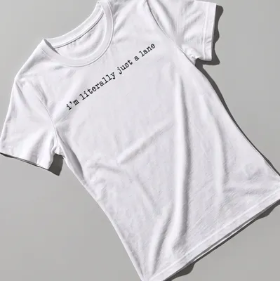 Simple text design with black lettering that reads 'I'm literally just a lane' on a white — printed on a women's shirt