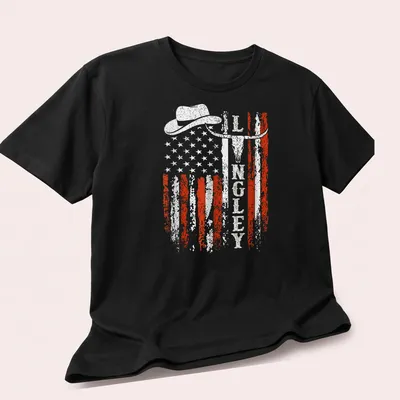 Retro distressed design of cowboy hat, longhorn skull, and American flag — printed on a unisex t-shirt (angled view)