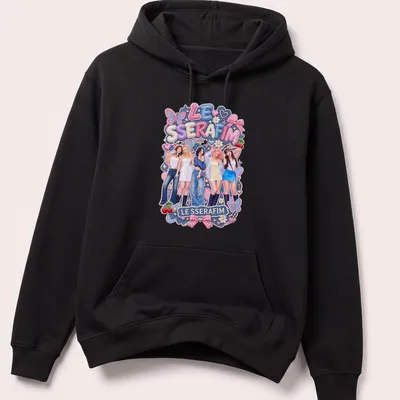 Colorful illustration of LE SSERAFIM with playful design elements — printed on a unisex hoodie