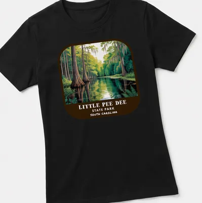 Vintage illustration of swamp landscape with cypress trees and text for Little Pee Dee State Park — printed on a women's shirt