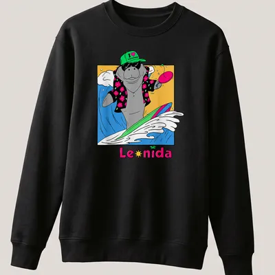 Cartoon manatee surfing with the text 'I ❤️ VACATION' in bright colors — printed on a unisex sweatshirt