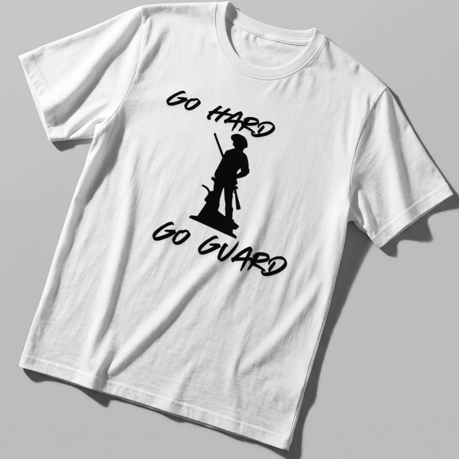 Bold script of 'Go Hard Go Guard' with military guard silhouette design — printed on a unisex t-shirt