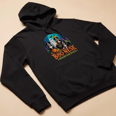 Colorful Halloween illustration of Mountain Dogs in witch costumes with pumpkins — printed on a unisex hoodie