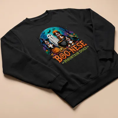 Colorful Halloween illustration of Mountain Dogs in witch costumes with pumpkins — printed on a unisex sweatshirt