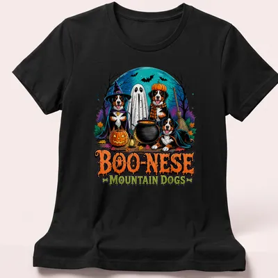 Colorful Halloween illustration of Mountain Dogs in witch costumes with pumpkins — printed on a women's shirt