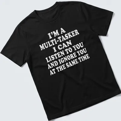 Bold white text humorously stating multitasking skills on light gray T-shirt.