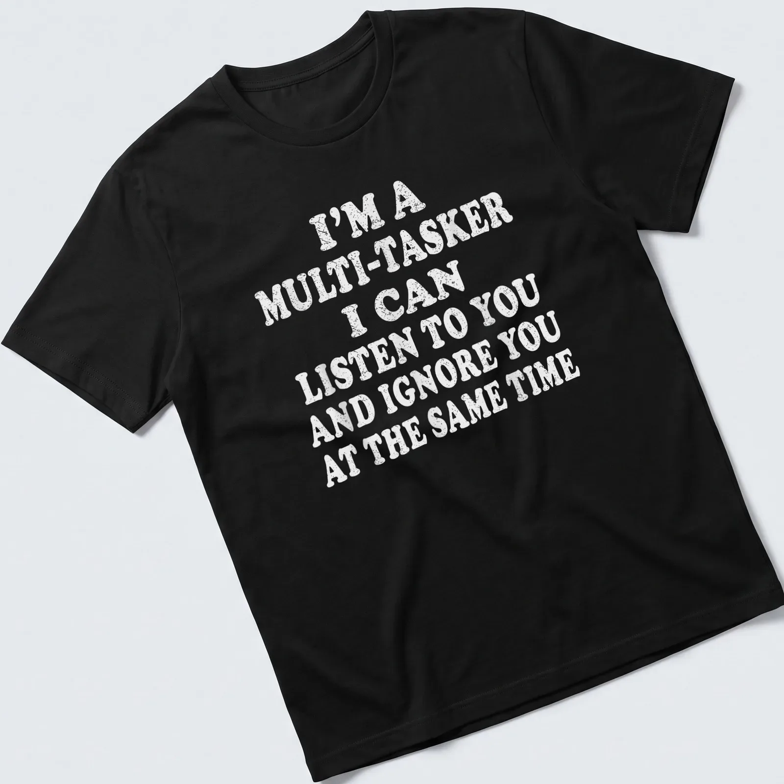 Bold white text humorously stating multitasking skills on light gray T-shirt. — printed on a unisex t-shirt
