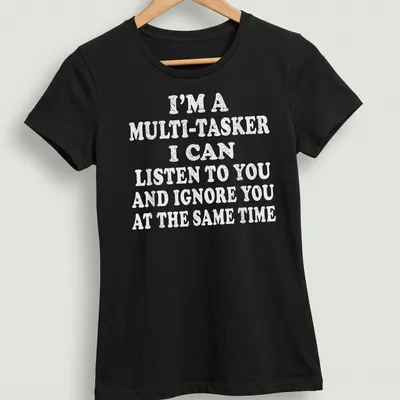 Bold white text humorously stating multitasking skills on light gray T-shirt. — printed on a women's shirt