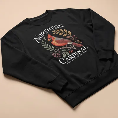 Illustrative Northern Cardinal perched in branches with red, green, and brown hues. — printed on a unisex sweatshirt