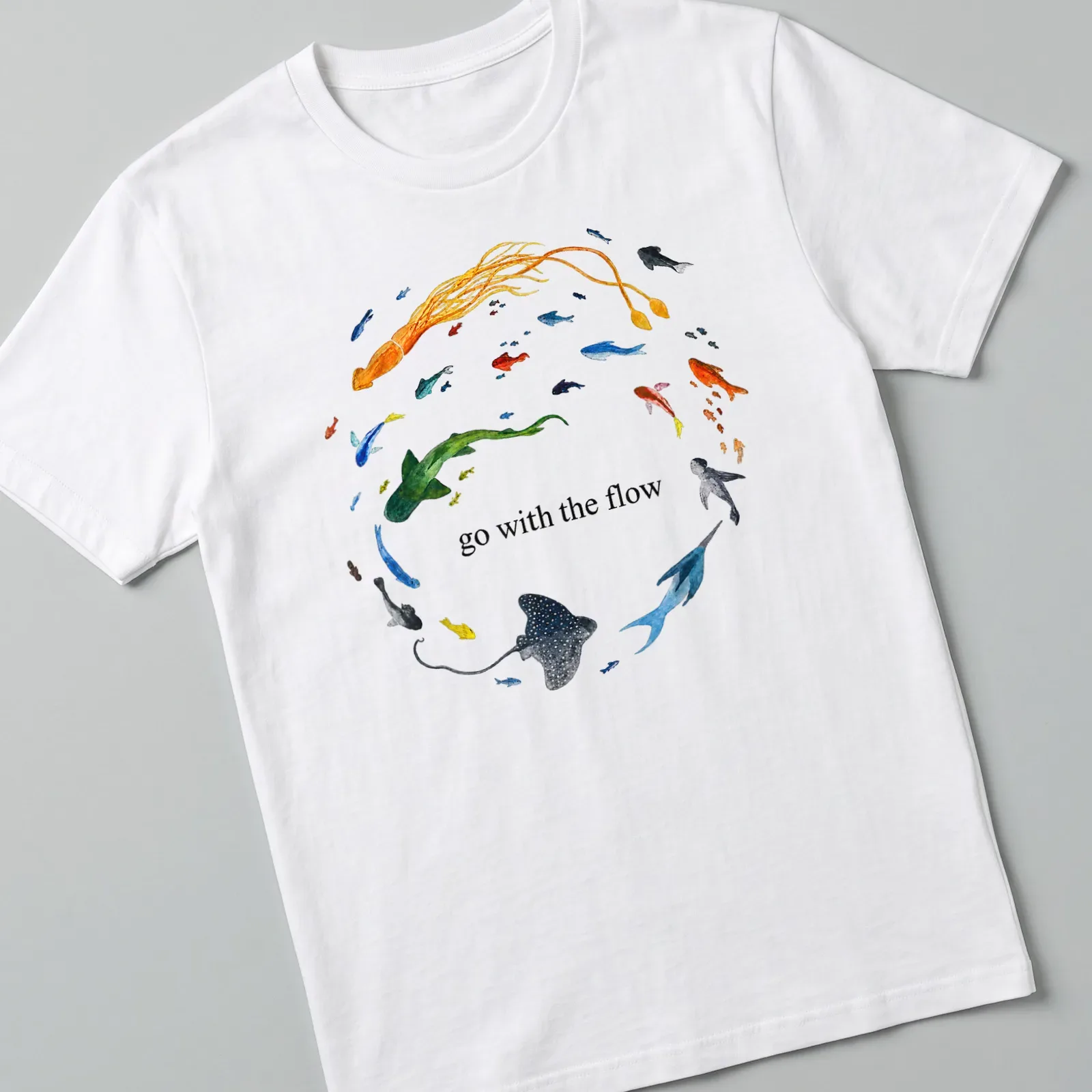 Watercolor print of ocean animals with the phrase 'go with the flow' in vibrant colors — printed on a unisex t-shirt