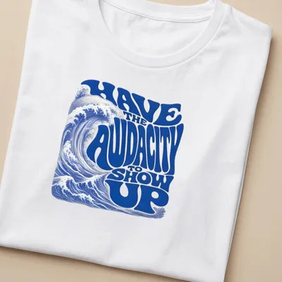Retro wave design featuring an ocean wave and bold motivational text. — printed on a women's shirt